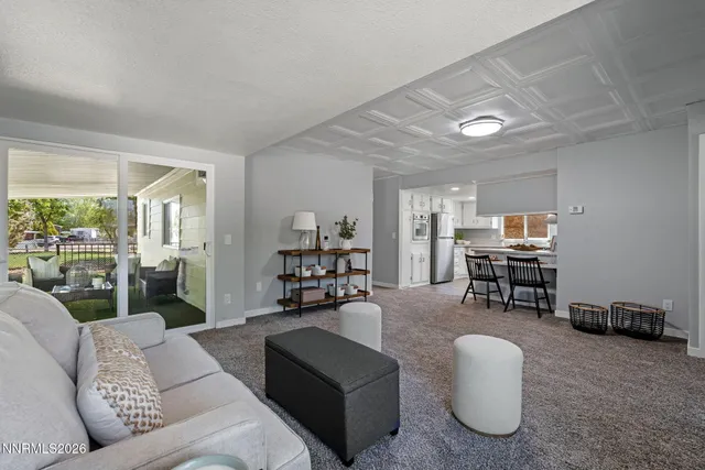 a living room with furniture and a table