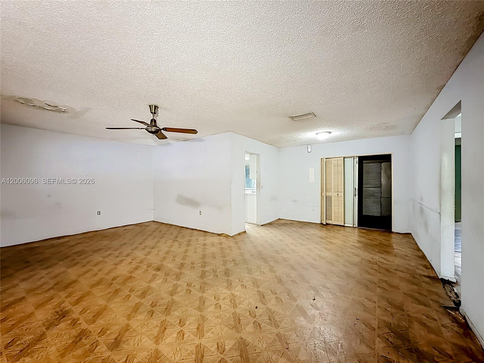 750 North Douglas Road Pembroke Pines, FL 33024 - Photo 1 of 6 an empty room with closet and chandelier fan