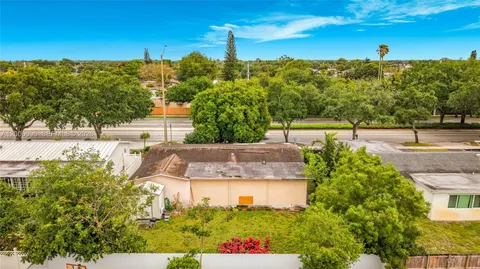 a view of a swimming pool with a yard