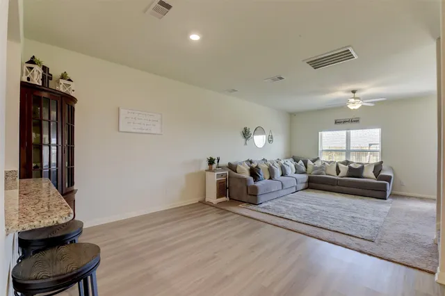a living room with furniture and a couch