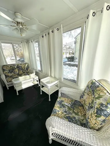 a living room with furniture and a window