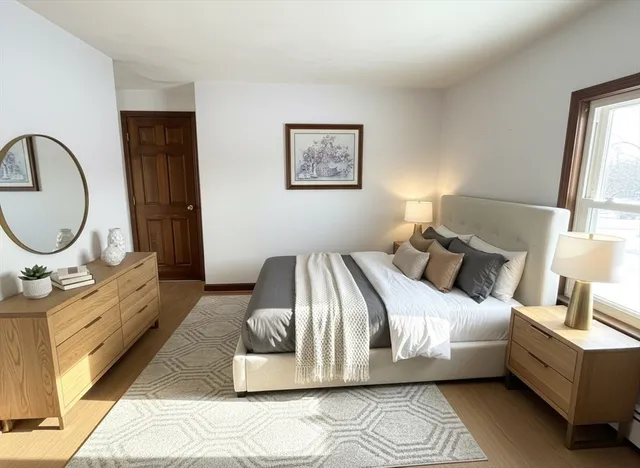 a bed room with a bed mirror and a window