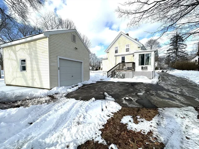 a view of a house with a snow in the yard