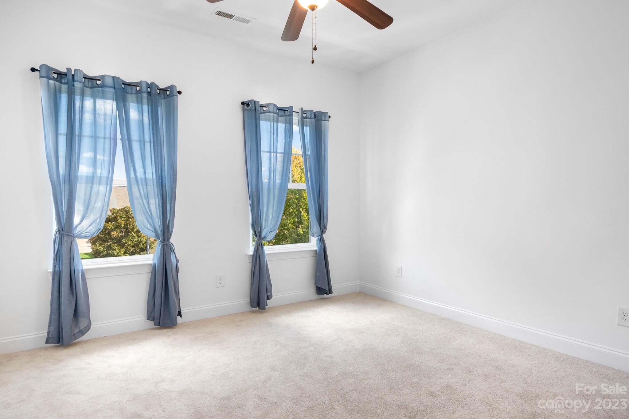 3329 Lucy Drive Monroe, NC 28110 - Photo 14 of 28 an empty room with windows and closet