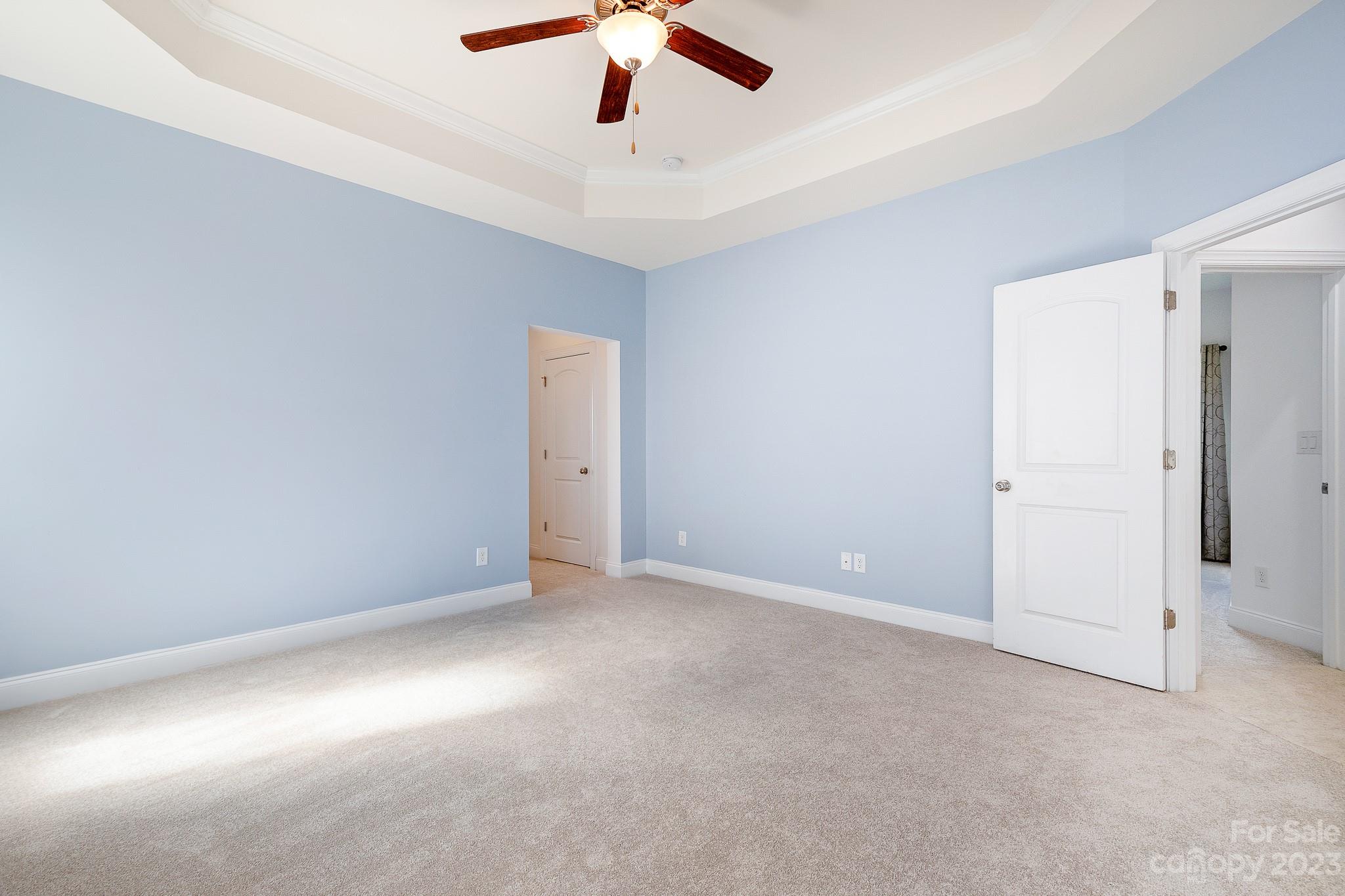 3329 Lucy Drive Monroe, NC 28110 - Photo 20 of 28 an empty room with a ceiling fan and a window