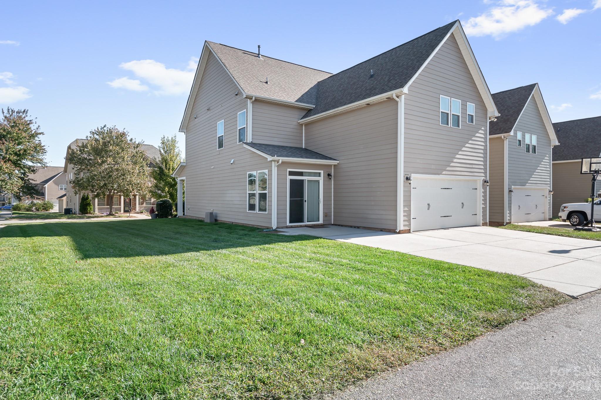 3329 Lucy Drive Monroe, NC 28110 - Photo 28 of 28 a view of a house with a yard and large tree