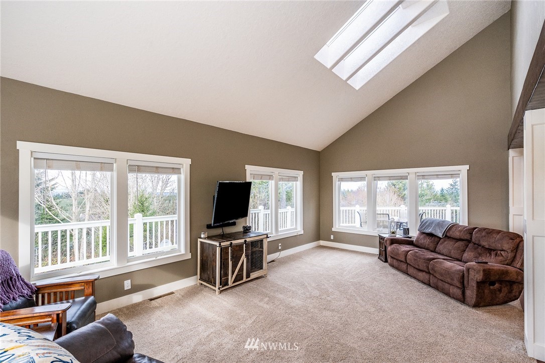 166 Ridgeview Road Chehalis, WA 98532 - Photo 8 of 40 a living room with furniture and a flat screen tv