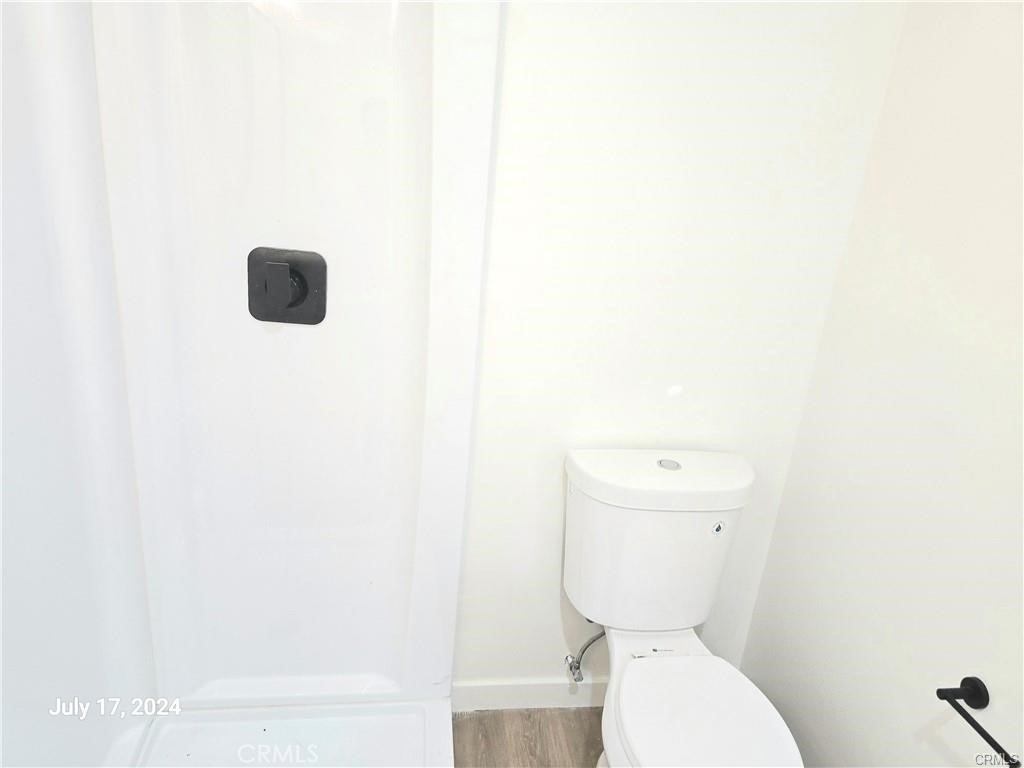8734 Ramsgate Avenue Los Angeles, CA 90045 - Photo 8 of 9 a white toilet sitting next to a white sink