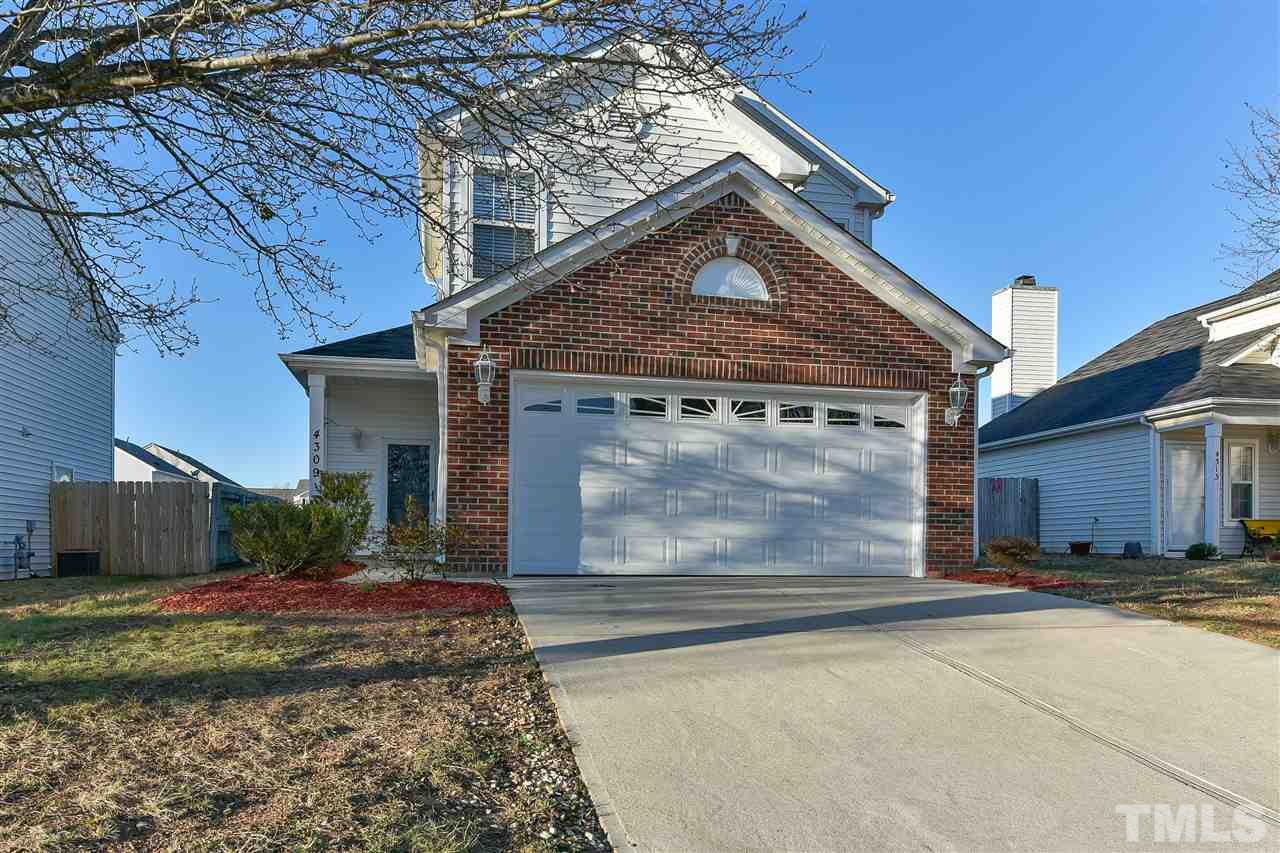 4309 Standing Rock Way Raleigh, NC 27604 - Photo 1 of 7 a front view of a house with a yard