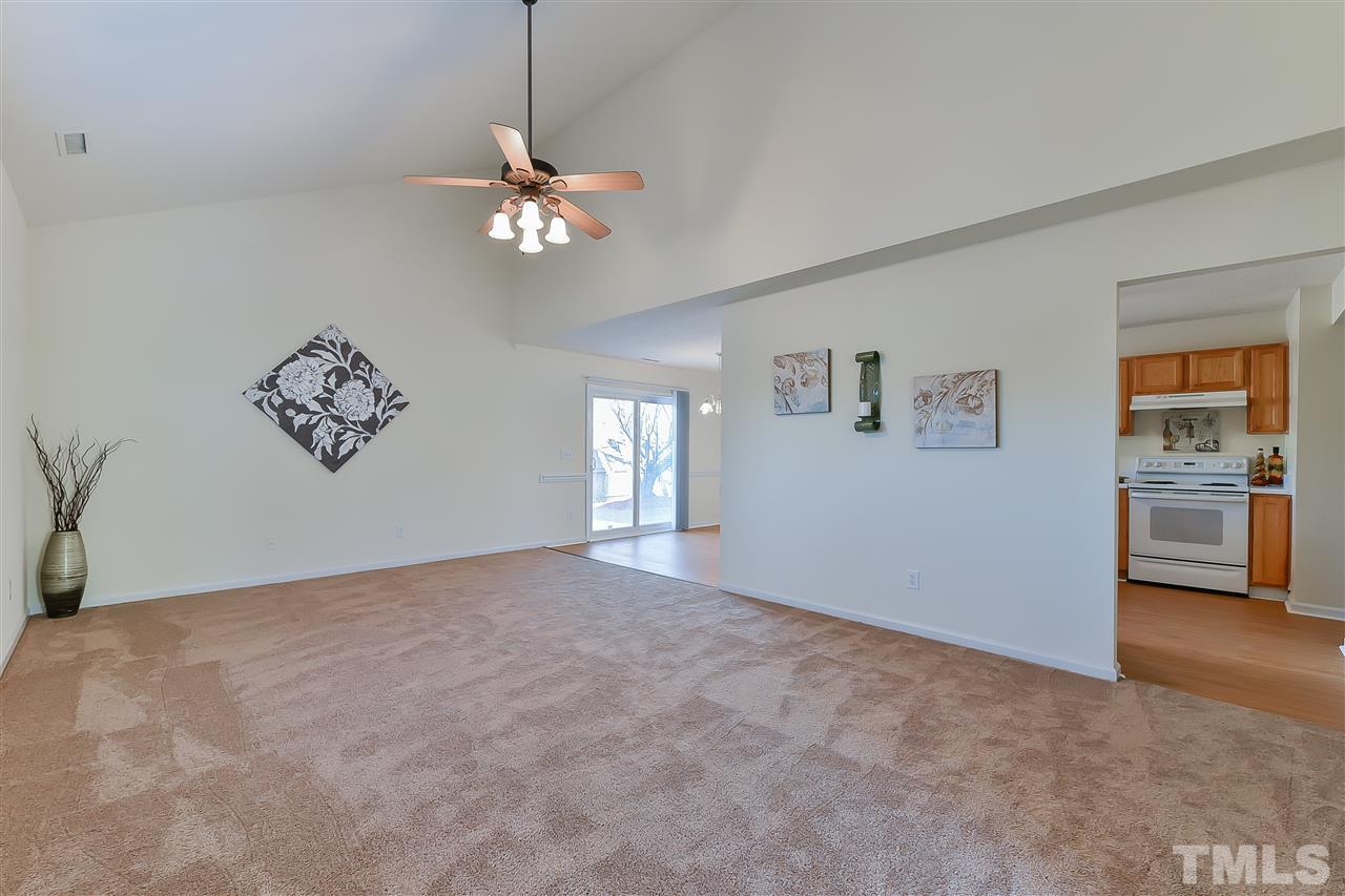 4309 Standing Rock Way Raleigh, NC 27604 - Photo 2 of 7 a view of a livingroom with a ceiling fan and window