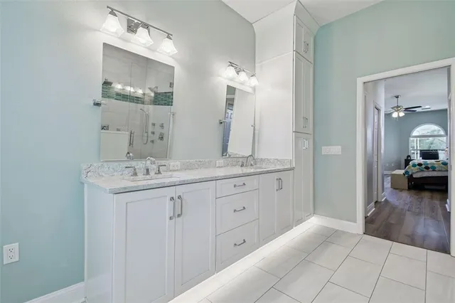 a bathroom with a shower a toilet and sink