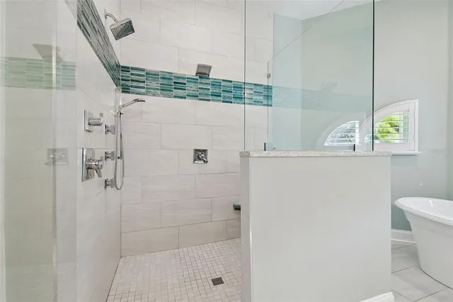 a view of a bathroom with a shower and a sink