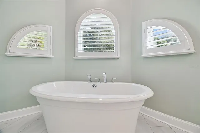 a work room with furniture and a window