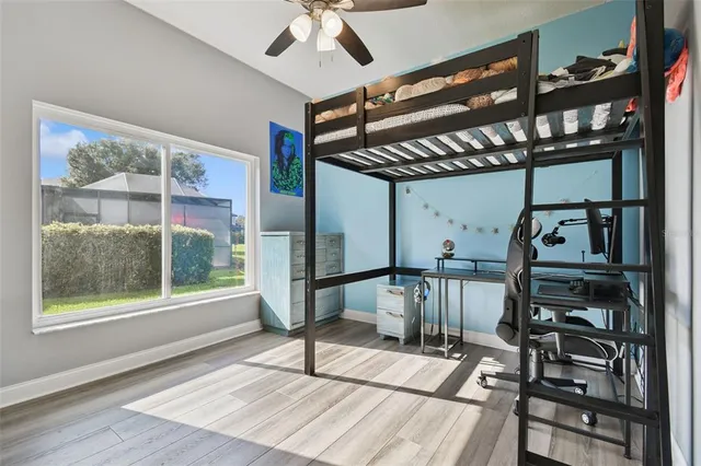 a bed room with a bed and a chandelier