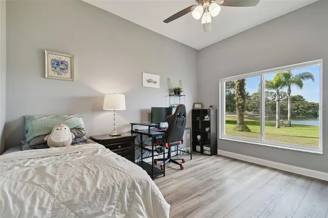 a view of walk in closet with wooden floor