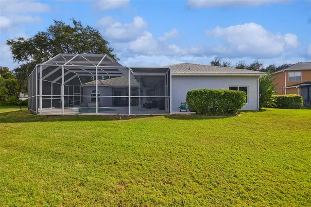 an aerial view of a house with outdoor space lake view