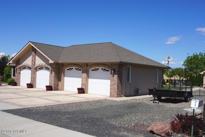 767 East Charron Road Moxee, WA 98936 - Photo 2 of 24 a view of a house with a patio