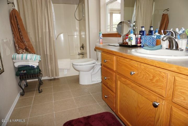 767 East Charron Road Moxee, WA 98936 - Photo 10 of 24 a bathroom with a sink toilet and shower