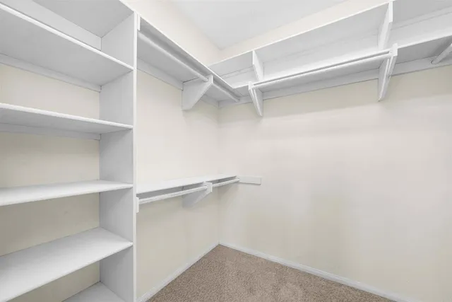 a view of an empty walk in closet