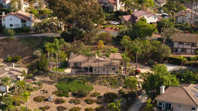 a view of residential houses with outdoor space and street view