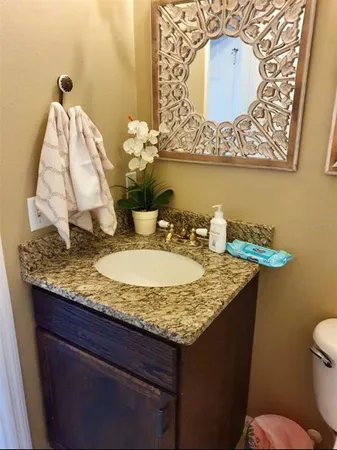 a bathroom with a sink a mirror and a bathtub