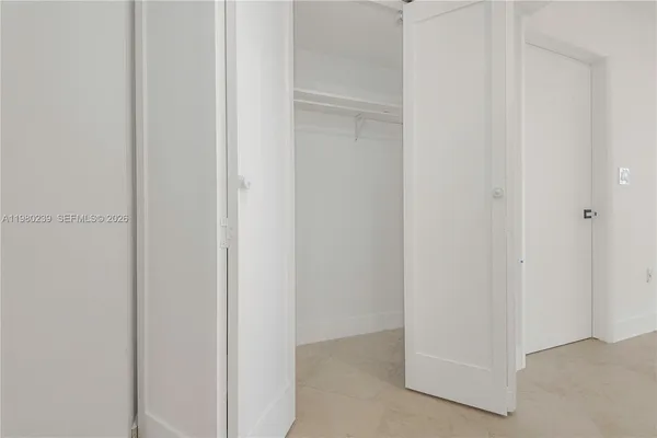 an empty room with large window