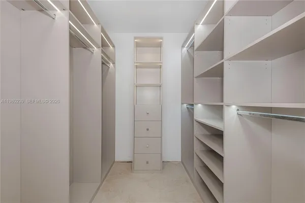 a bathroom with a shower and a sink