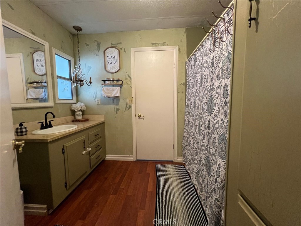 201 West Collins Avenue, Unit 40 Orange, CA 92867 - Photo 12 of 15 a view of a bathroom with sink and shower