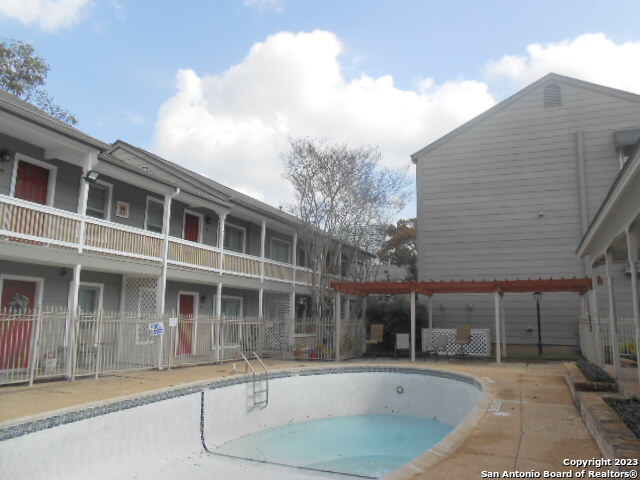 2300 Nacogdoches Road, Unit 118E San Antonio, TX 78209 - Photo 2 of 35 a front view of a house with a garden