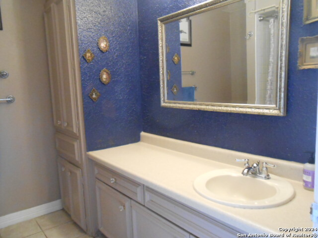 2300 Nacogdoches Road, Unit 118E San Antonio, TX 78209 - Photo 28 of 35 a bathroom with a sink and a mirror