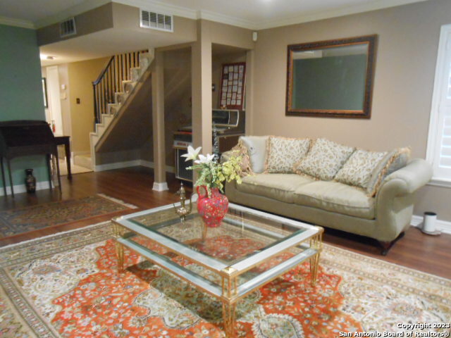 2300 Nacogdoches Road, Unit 118E San Antonio, TX 78209 - Photo 3 of 35 a living room with a couch and a rug