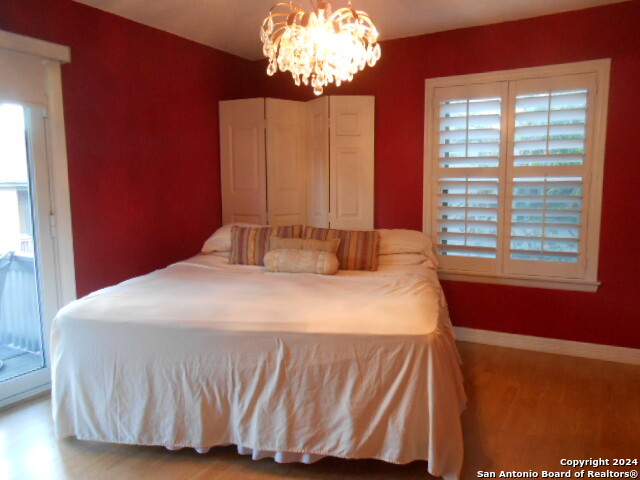 2300 Nacogdoches Road, Unit 118E San Antonio, TX 78209 - Photo 31 of 35 a bedroom with a bed and a window