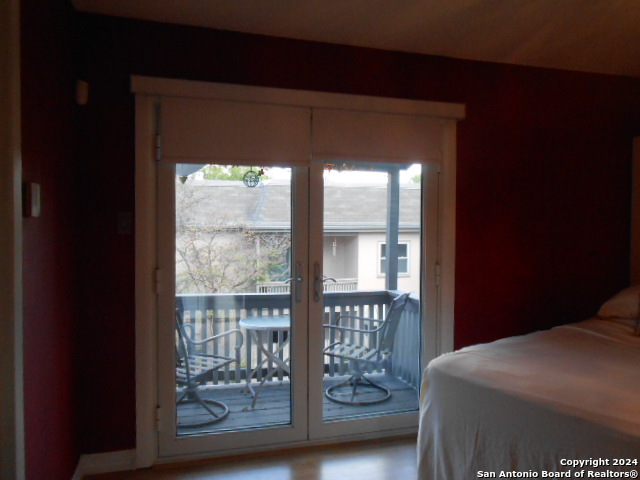 2300 Nacogdoches Road, Unit 118E San Antonio, TX 78209 - Photo 33 of 35 a bedroom with a bed and a window