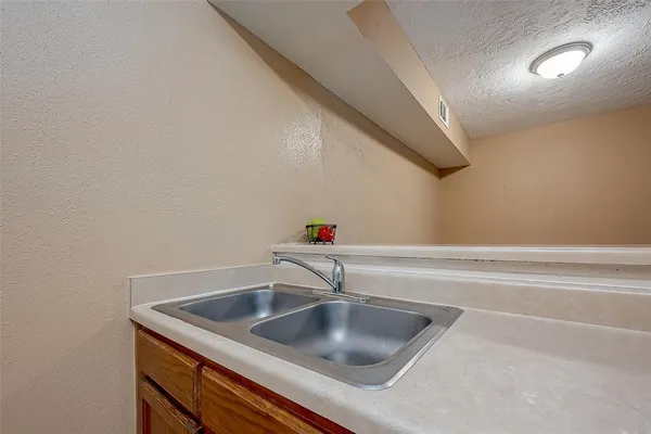 a kitchen with stainless steel appliances a stove and a refrigerator