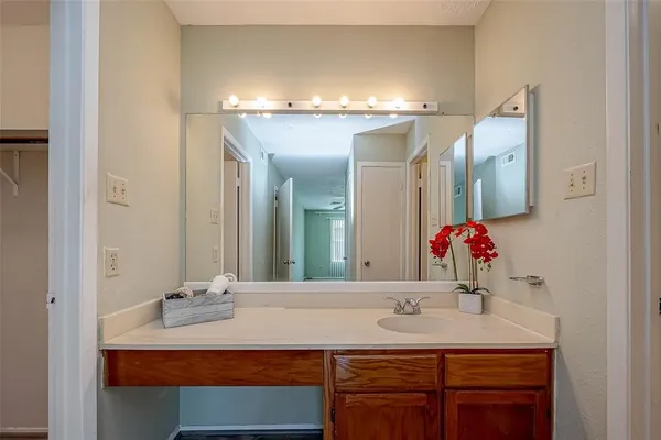 a bathroom with a sink double vanity and a mirror