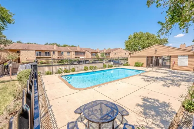 a front view of a house with a garden and yard