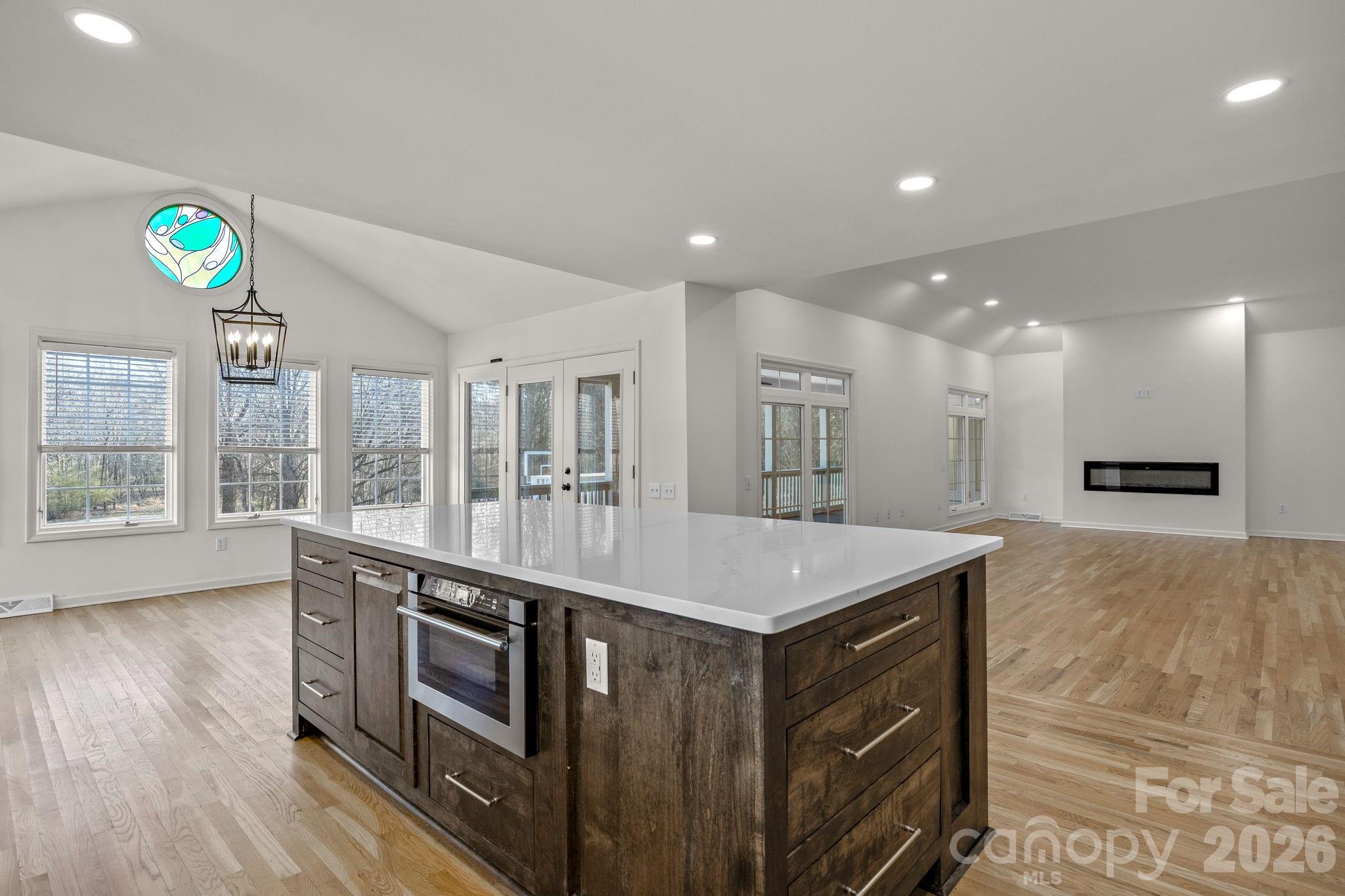 1 Sweetbriar Court Greer, SC 29650 - Photo 12 of 48 a kitchen with kitchen island a sink stainless steel appliances and a counter top space