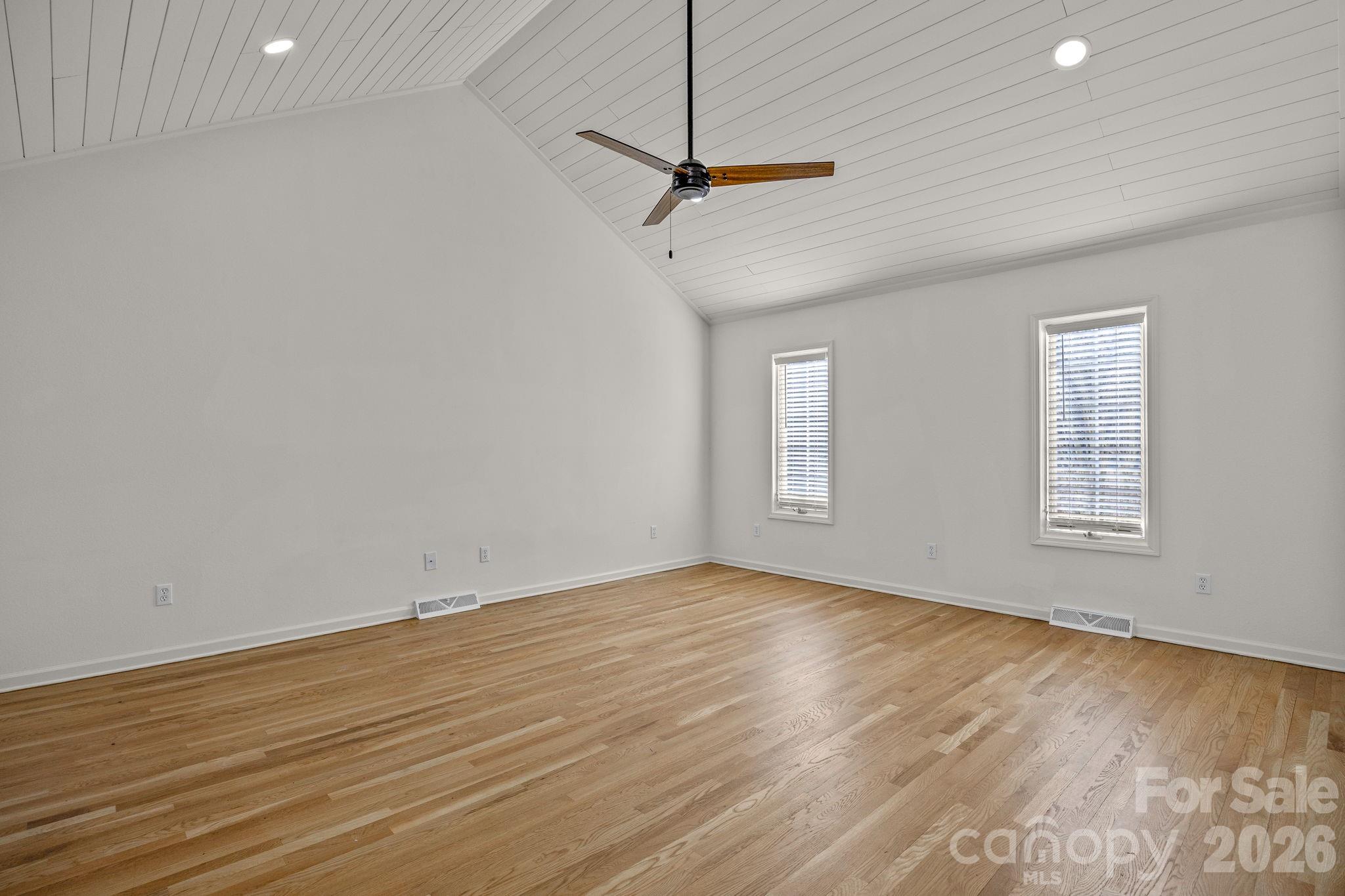 1 Sweetbriar Court Greer, SC 29650 - Photo 16 of 48 a view of a room with wooden floor and ceiling fan