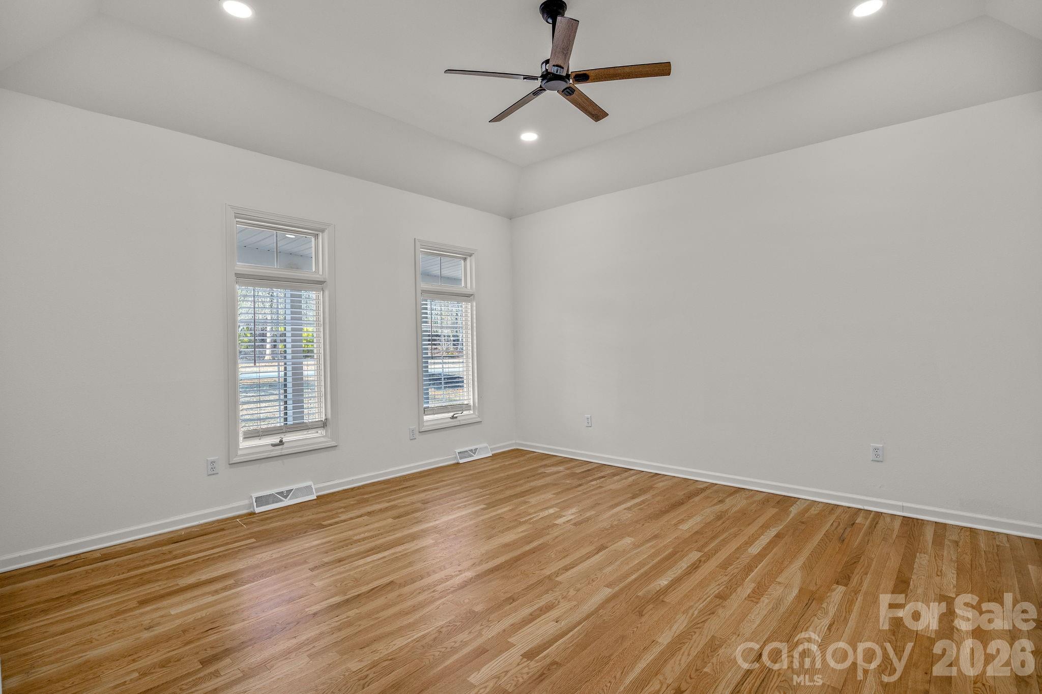 1 Sweetbriar Court Greer, SC 29650 - Photo 20 of 48 a view of empty room with wooden floor and fan