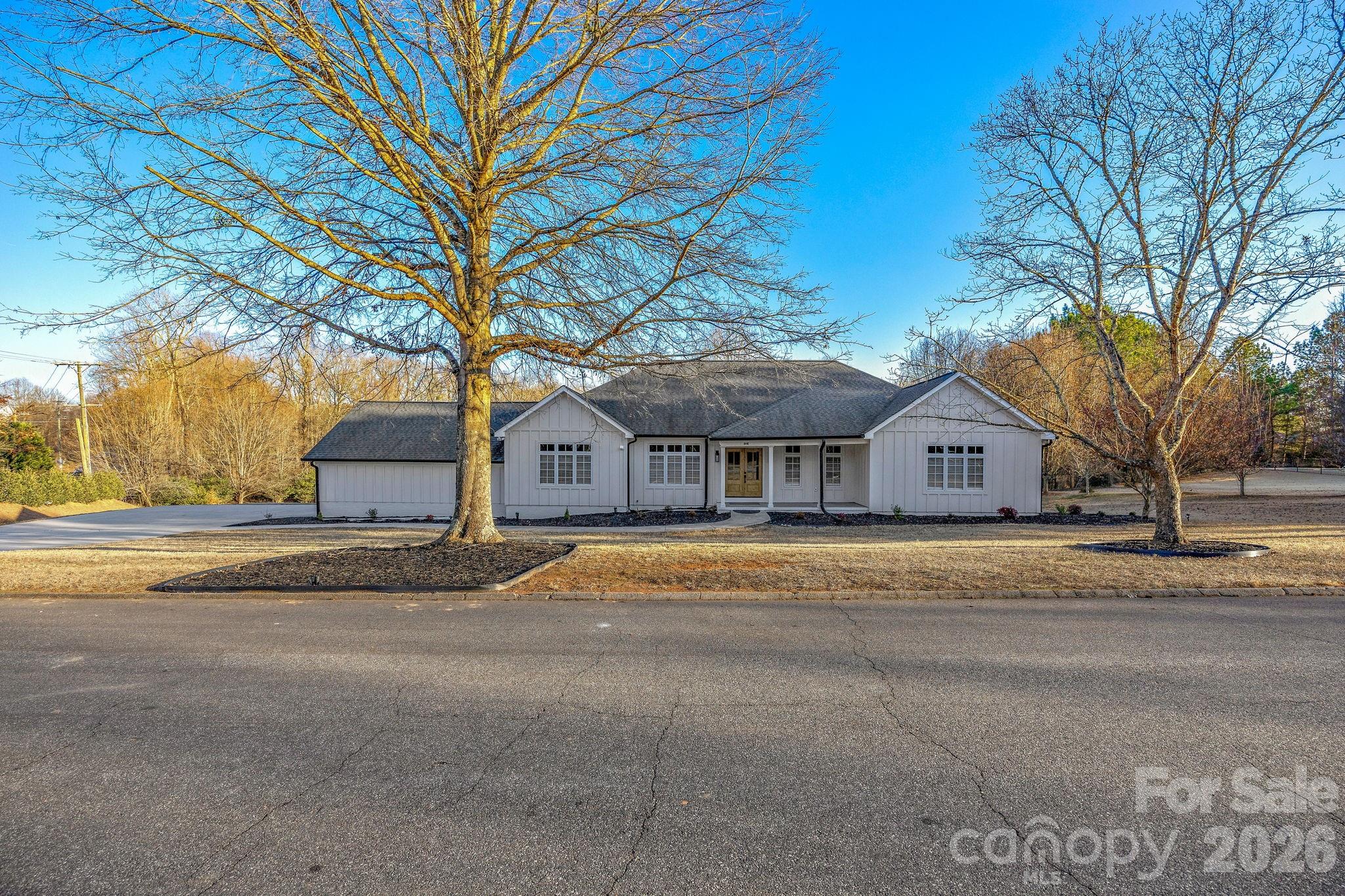 1 Sweetbriar Court Greer, SC 29650 - Photo 2 of 48 a front view of house with a yard and trees