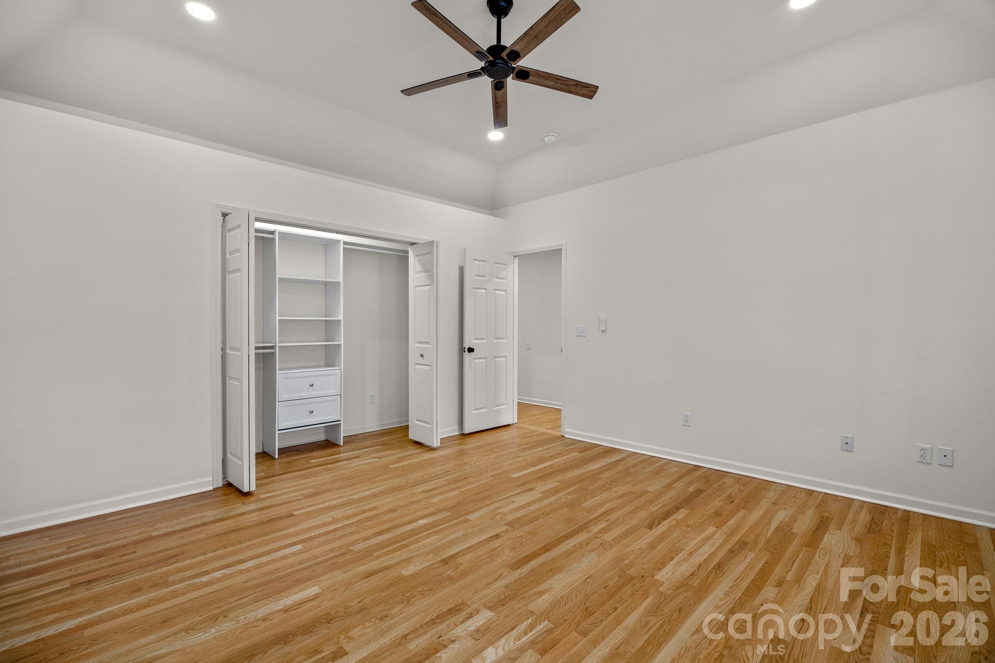 1 Sweetbriar Court Greer, SC 29650 - Photo 21 of 48 a view of a room with wooden floor and a ceiling fan