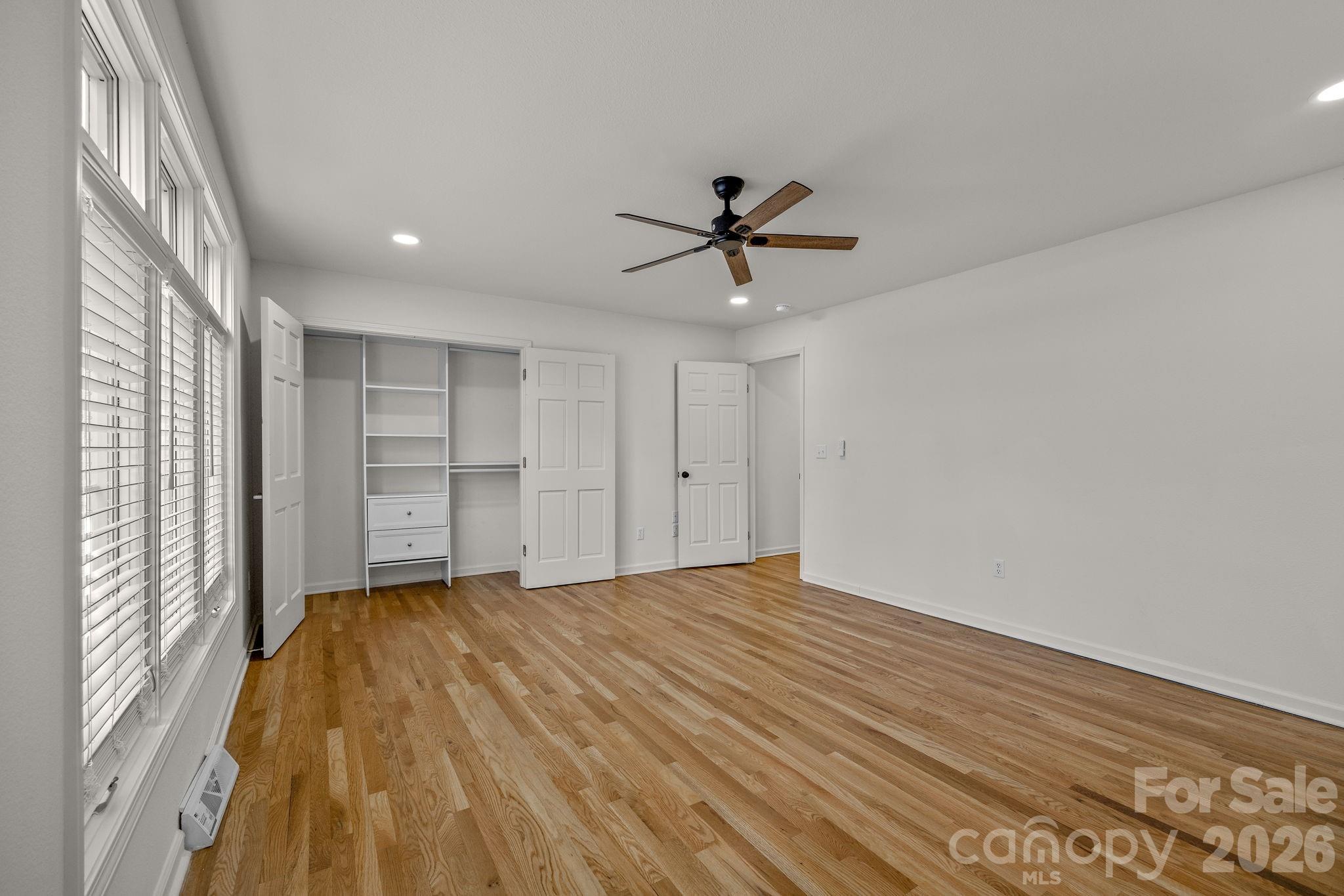 1 Sweetbriar Court Greer, SC 29650 - Photo 23 of 48 a view of empty room with wooden floor and fan