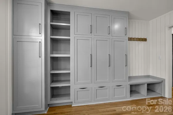 a view of walk in closet with empty racks