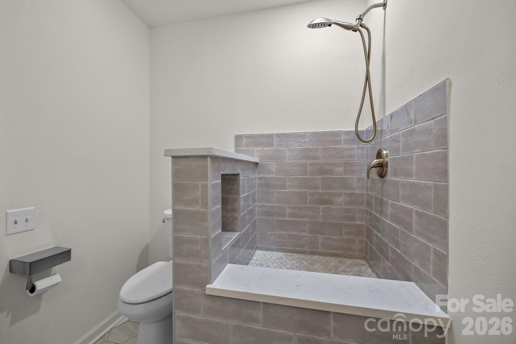 1 Sweetbriar Court Greer, SC 29650 - Photo 28 of 48 a bathroom with a shower and a toilet