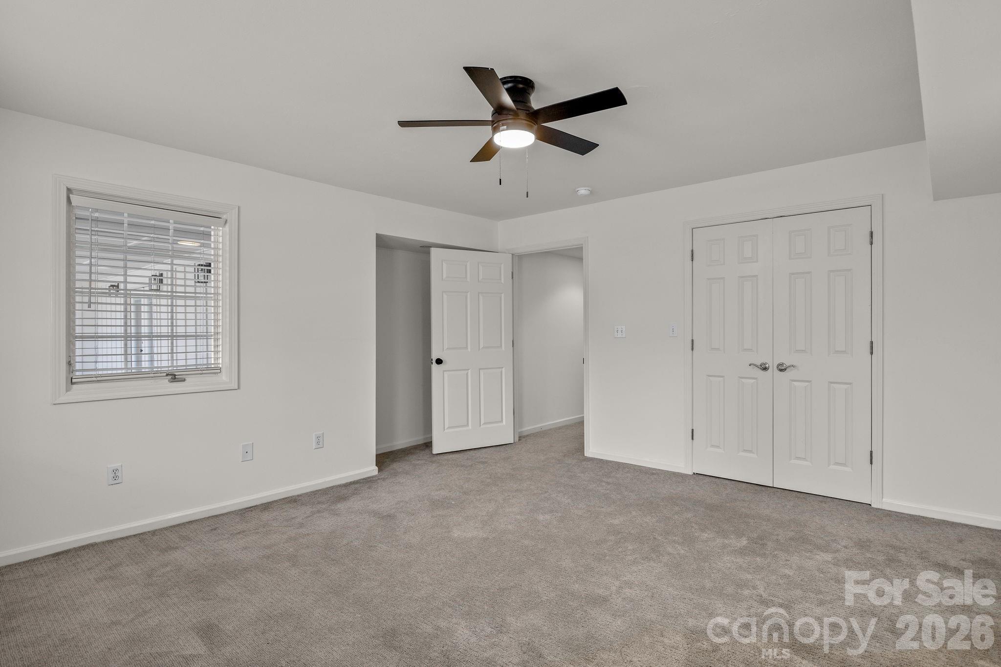1 Sweetbriar Court Greer, SC 29650 - Photo 35 of 48 a view of an empty room with a ceiling fan