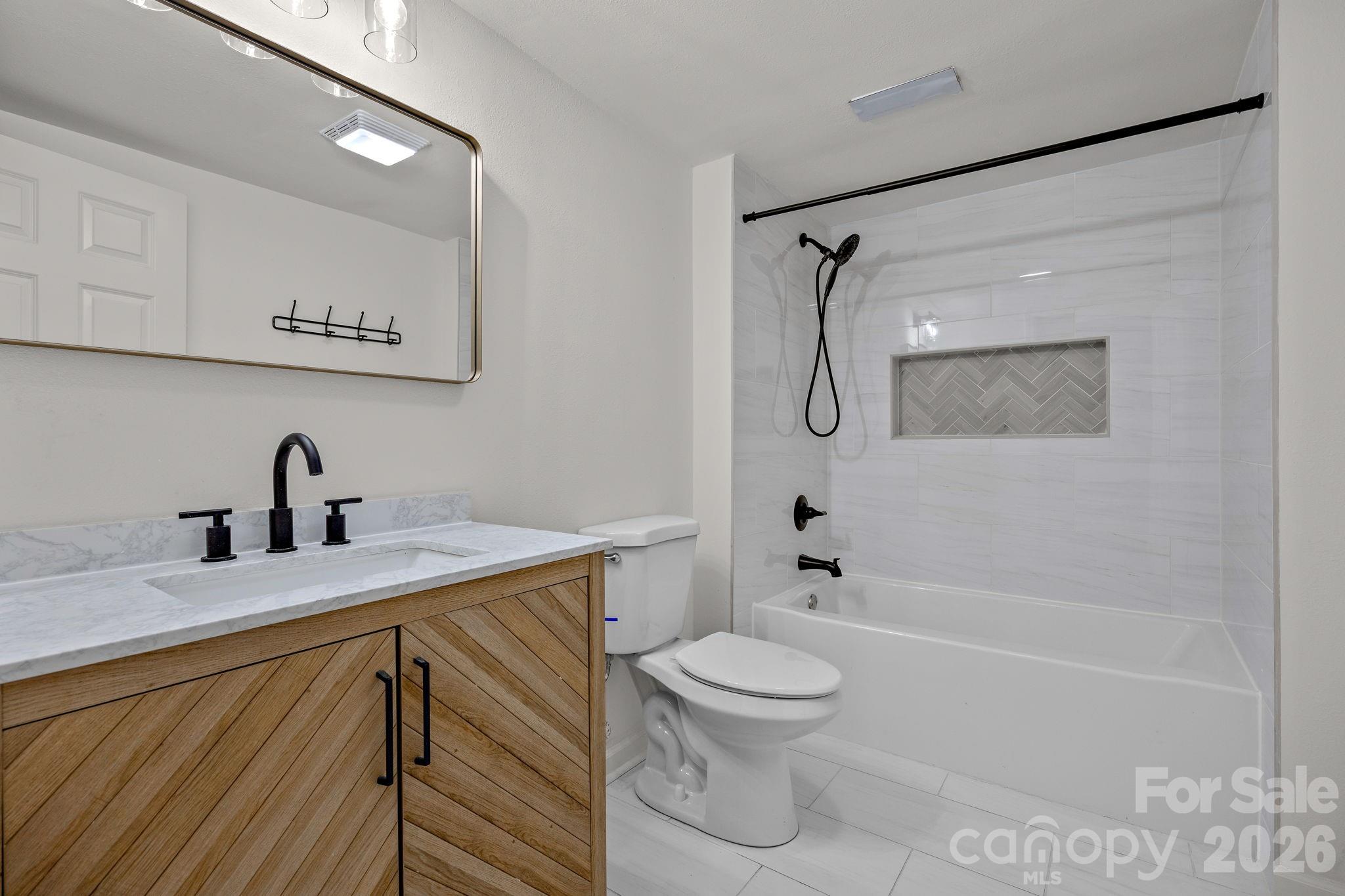 1 Sweetbriar Court Greer, SC 29650 - Photo 36 of 48 a bathroom with a sink a toilet and shower