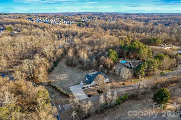 an aerial view of house with yard