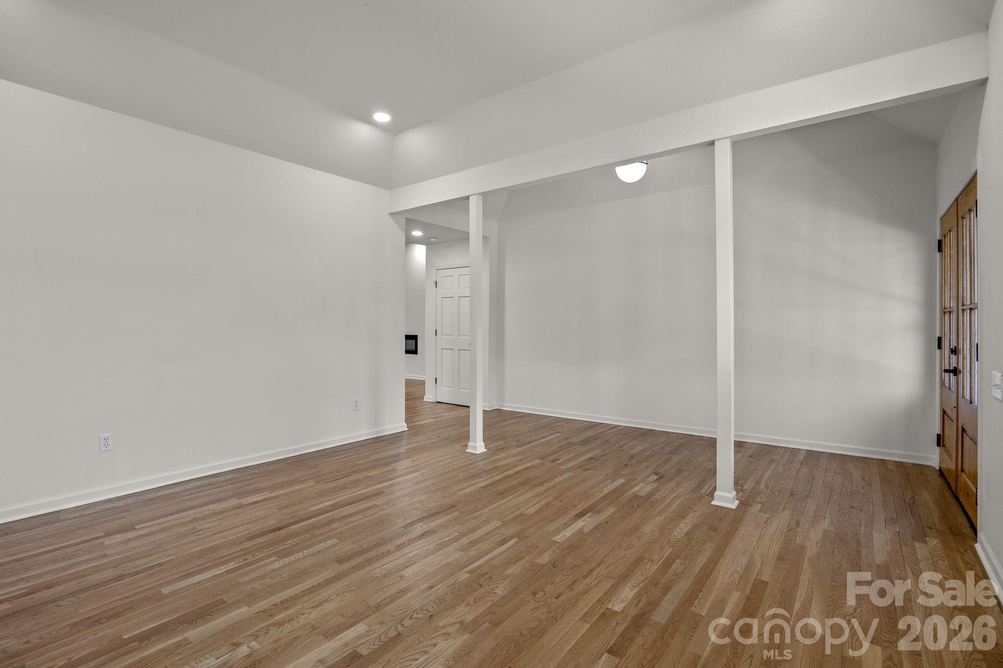 1 Sweetbriar Court Greer, SC 29650 - Photo 6 of 48 a view of an empty room with wooden floor