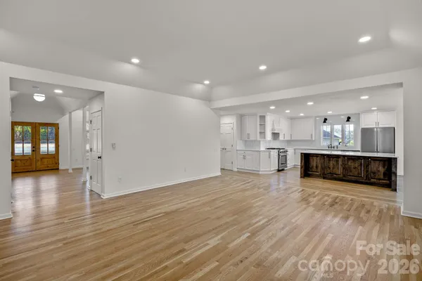 a view of kitchen with kitchen island and wooden floor