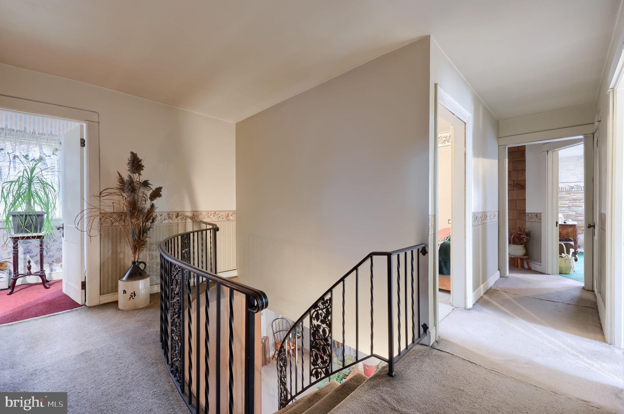 430 Stehman Road Lancaster, PA 17603 - Photo 17 of 43 a view of a hallway with wooden floor and stairs